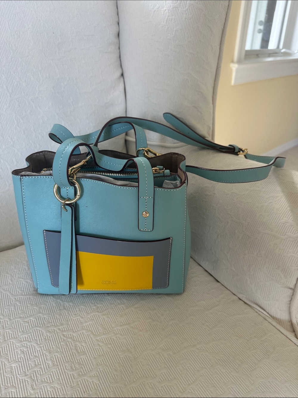 France’s Valentine Light Blue Leather Crossbody with Gray and Yellow Pocket